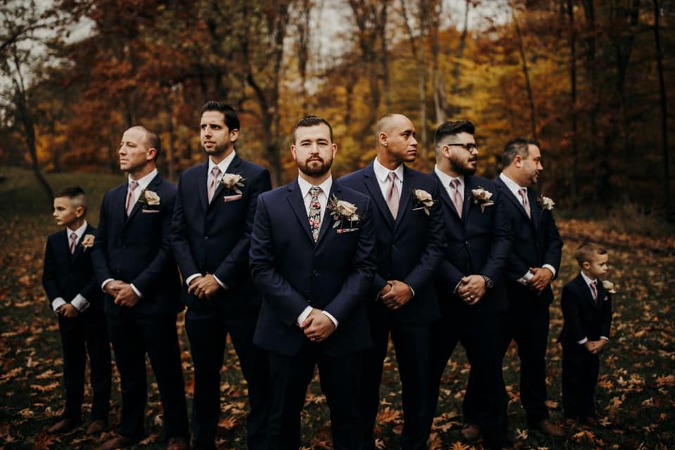 group of groomsmen wearing suits