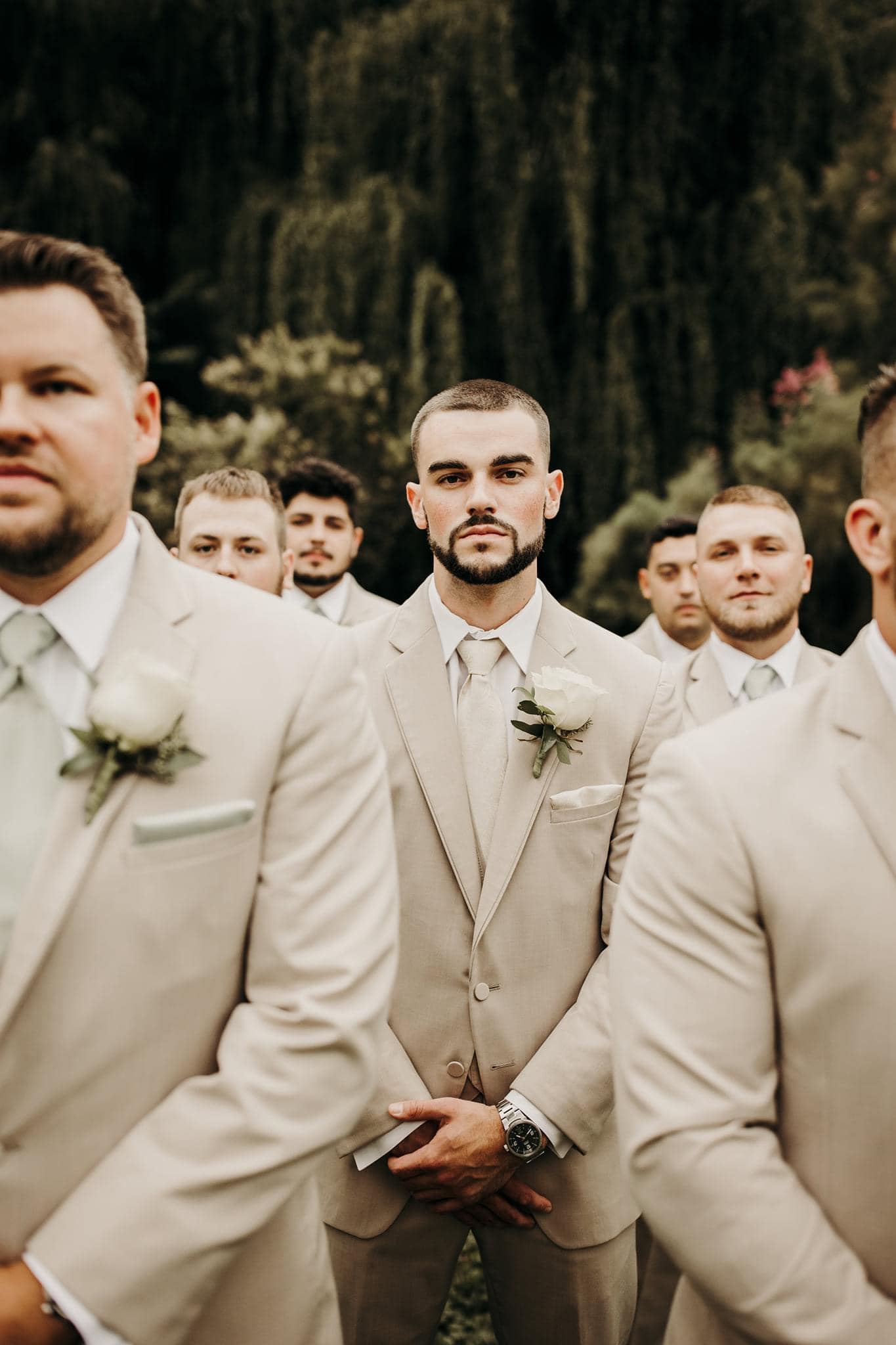 group of groomsmen wearing suits